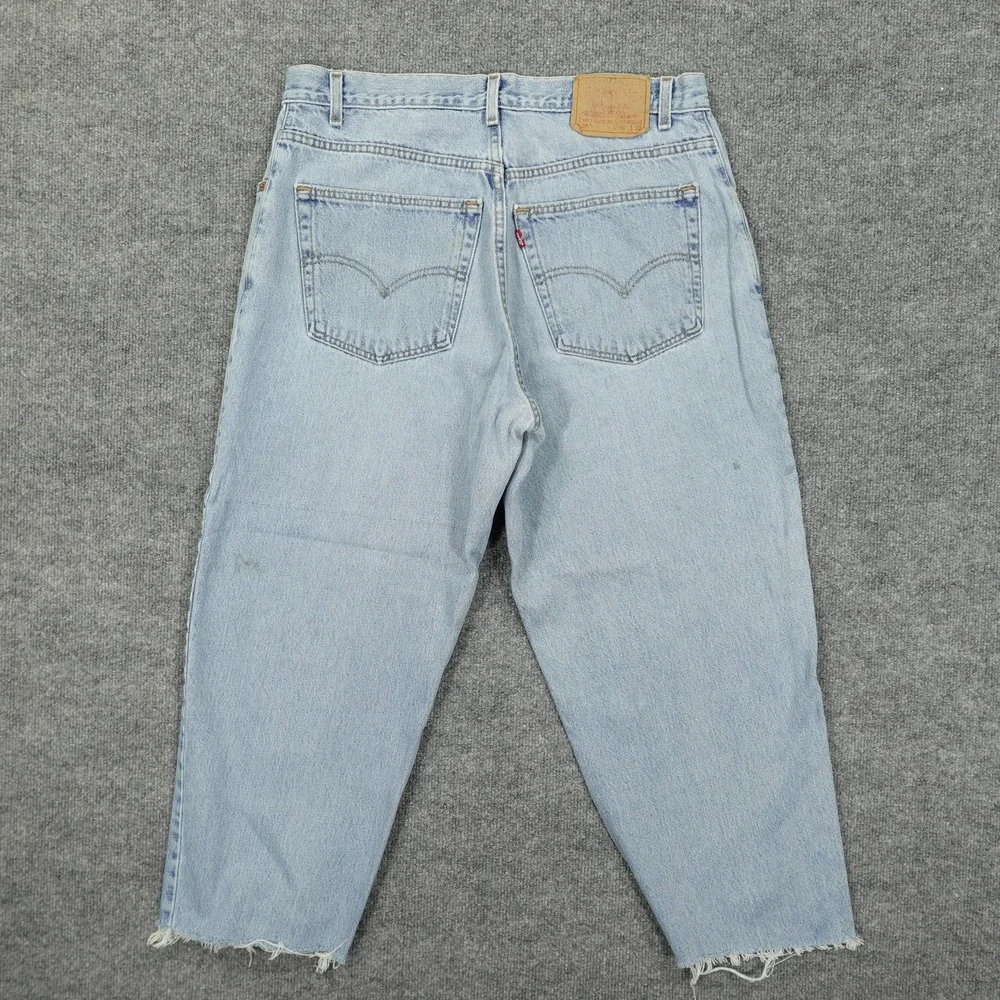 Vintage Levis 560 Jeans Mens 36x26 Light Wash Blue Relaxed Tapered Raw Hem
